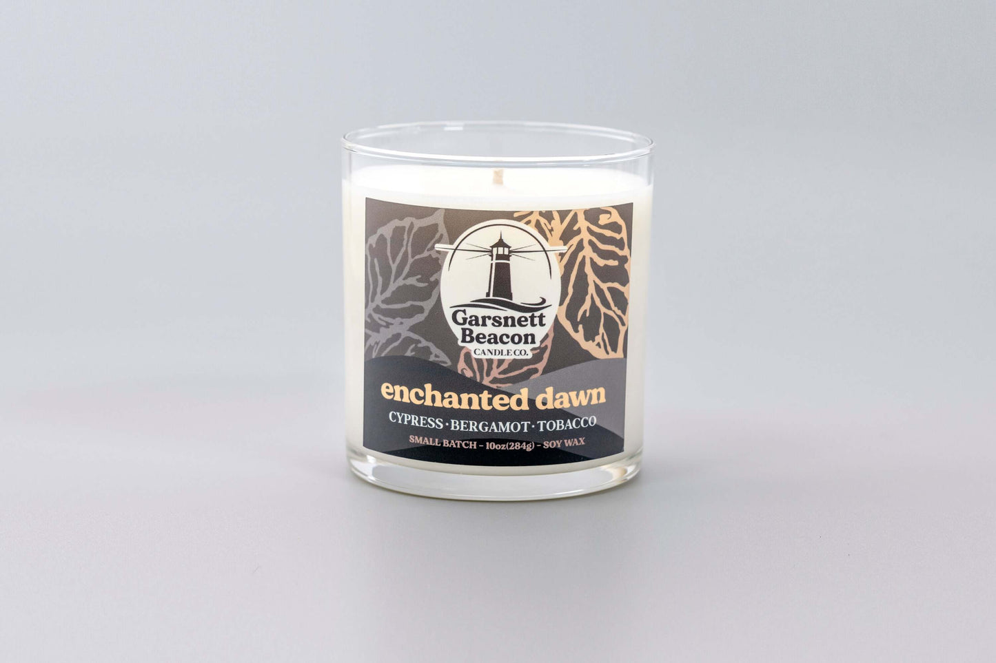 Cypress Bergamot Saffron Flower Patchoili scented candles called Enchanted Dawn in glass ceramic tin and wax melts