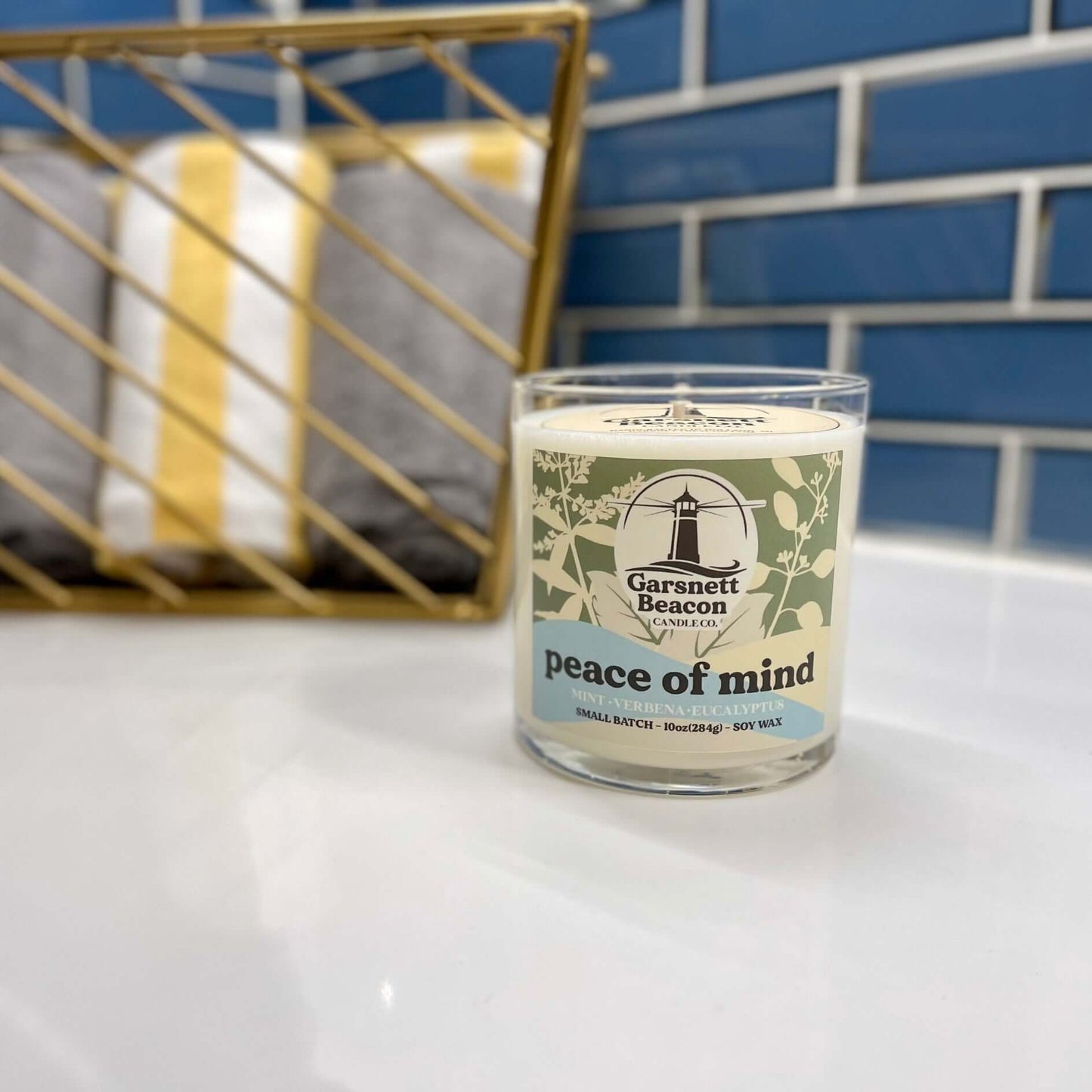 Fresh Mint Verbena Greens Eucalyptus scented candles called Peace of Mind in glass ceramic tin and wax melts