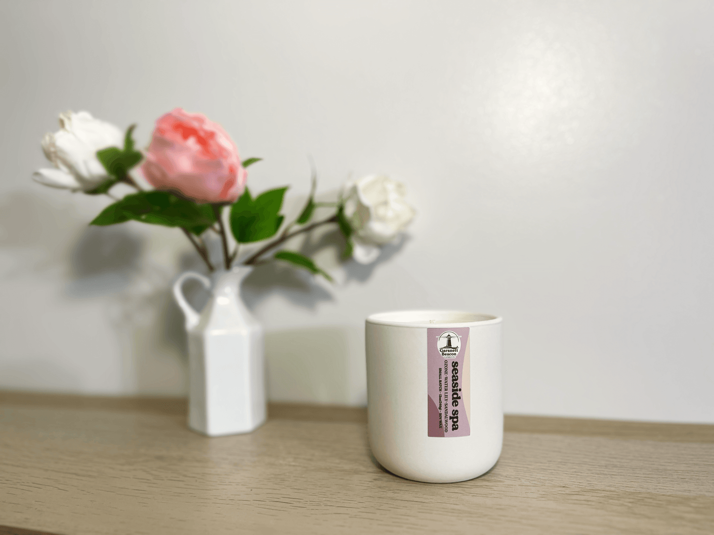 Jasmine Water Lily Sandalwood Moss Ozone Apple scented candles called Seaside Spa in glass ceramic tin and wax melts