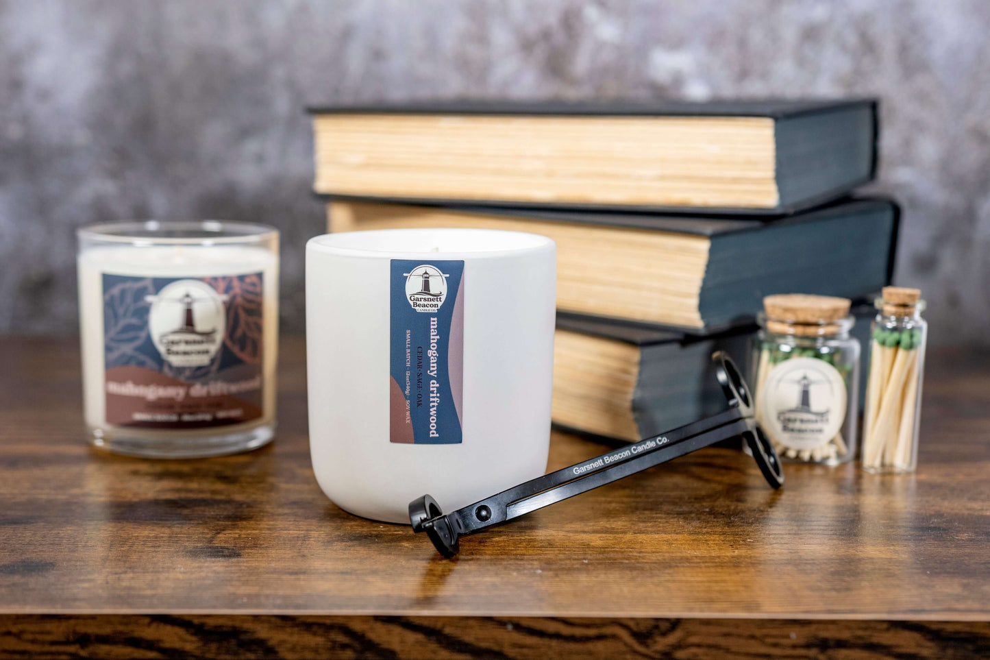 Mahogany Geranium Oak Cedar Eucalyptus Lavender Sage scented candles called Mahogany Driftwood in glass ceramic tin and wax melts