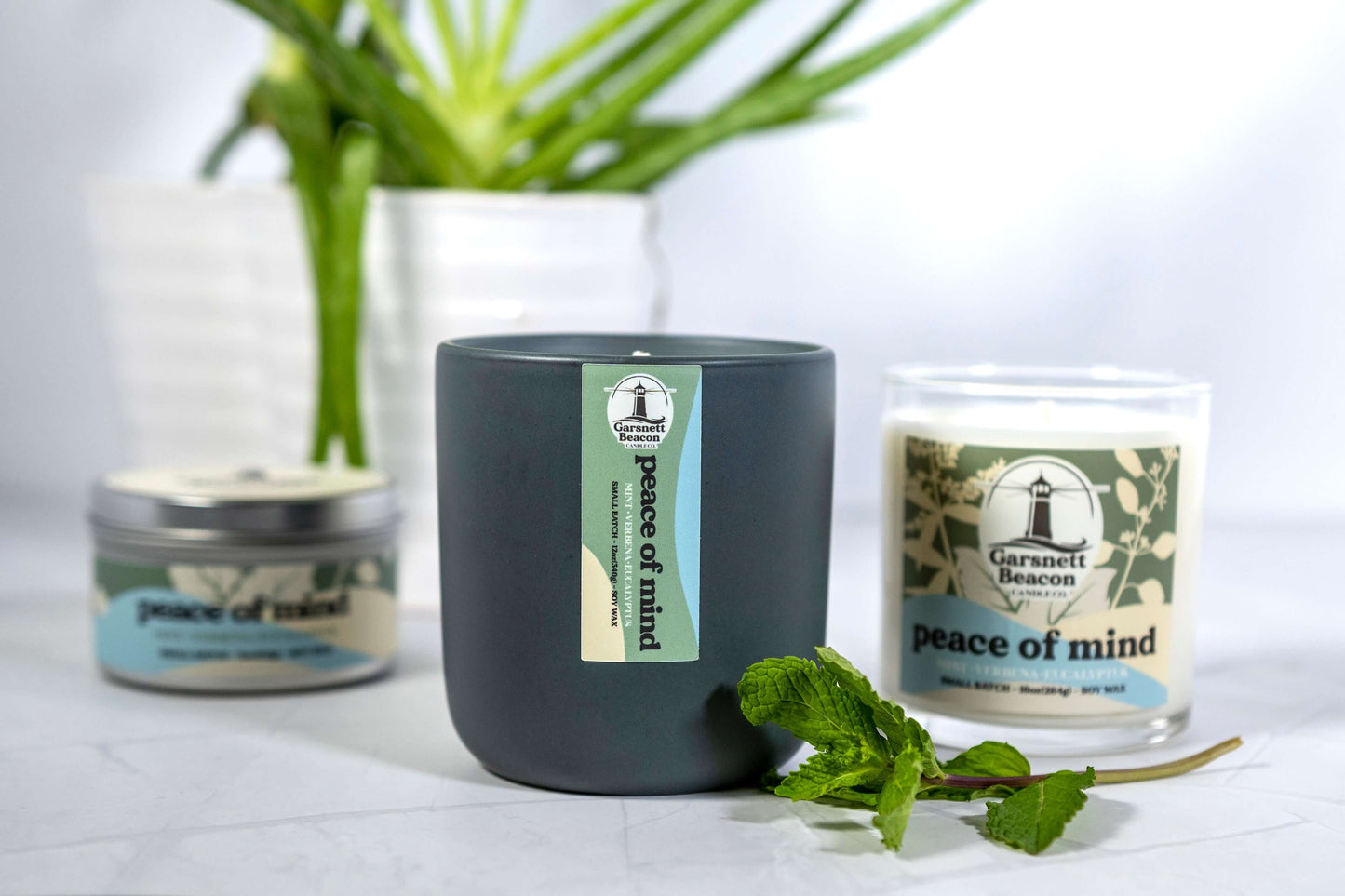 Fresh Mint Verbena Greens Eucalyptus scented candles called Peace of Mind in glass ceramic tin and wax melts