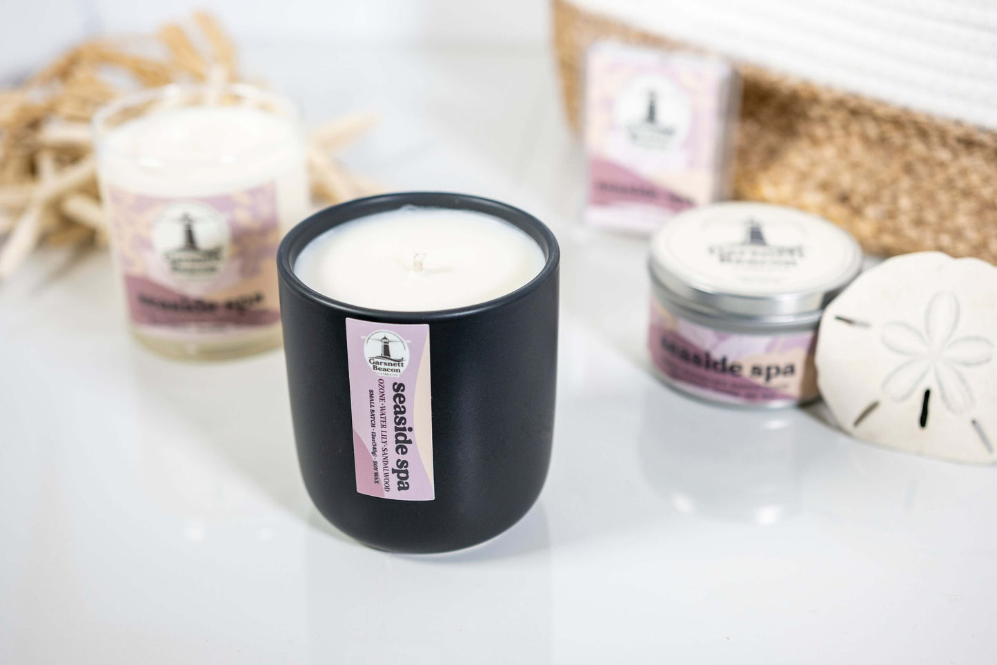 Jasmine Water Lily Sandalwood Moss Ozone Apple scented candles called Seaside Spa in glass ceramic tin and wax melts
