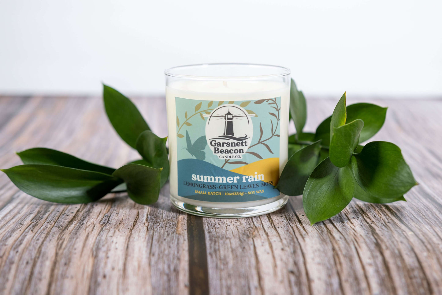 Lemongrass Green Leaves Lily of the Valley Ozone Moss scented candles called Summer Rain in glass ceramic tin and wax melts