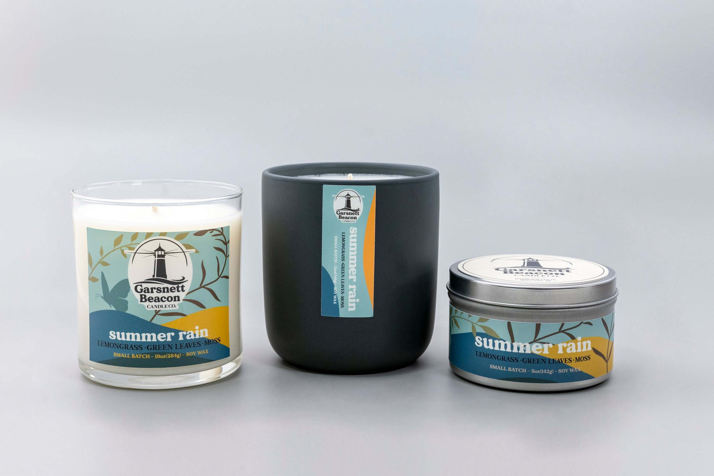 Lemongrass Green Leaves Lily of the Valley Ozone Moss scented candles called Summer Rain in glass ceramic tin and wax melts
