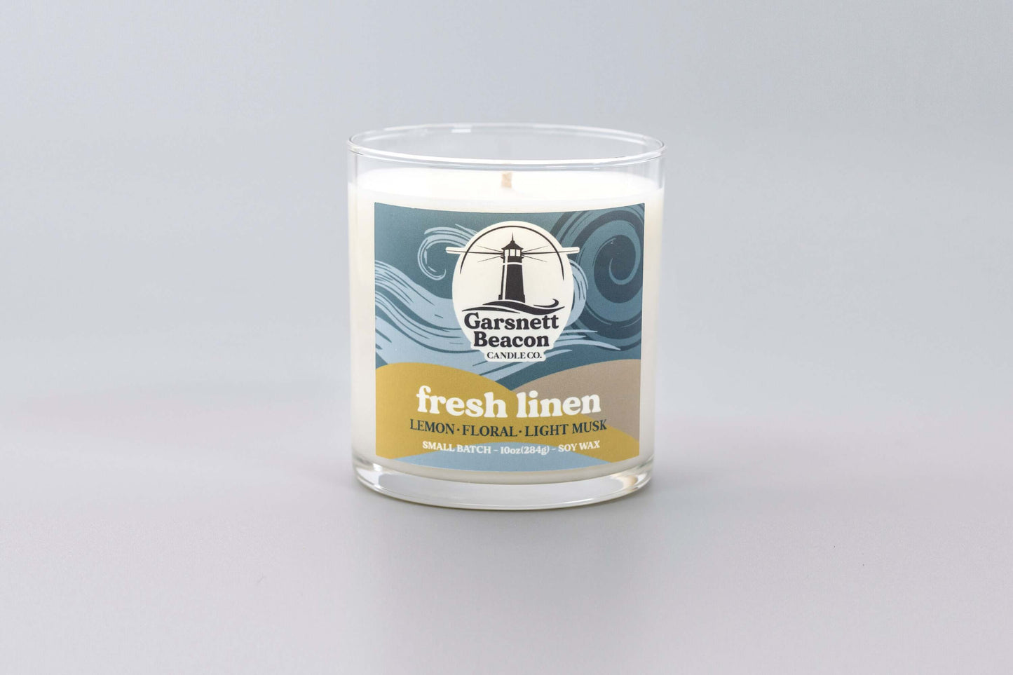 Lemon Linen Floral Ozone Light Musk scented candles called Fresh Linen in glass ceramic tin and wax melts