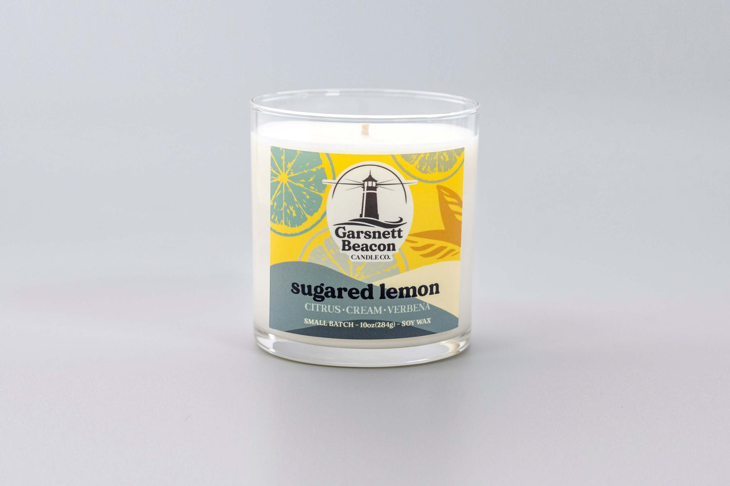 Lemon Cream Vanilla Citrus Verbena scented candles called Sugared Lemon in glass ceramic tin and wax melts