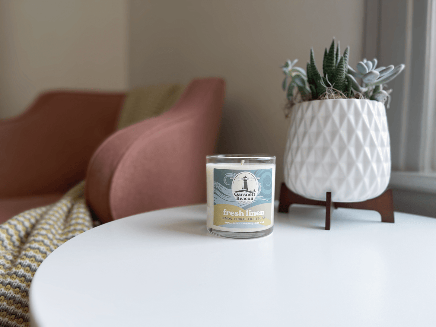 Lemon Linen Floral Ozone Light Musk scented candles called Fresh Linen in glass ceramic tin and wax melts