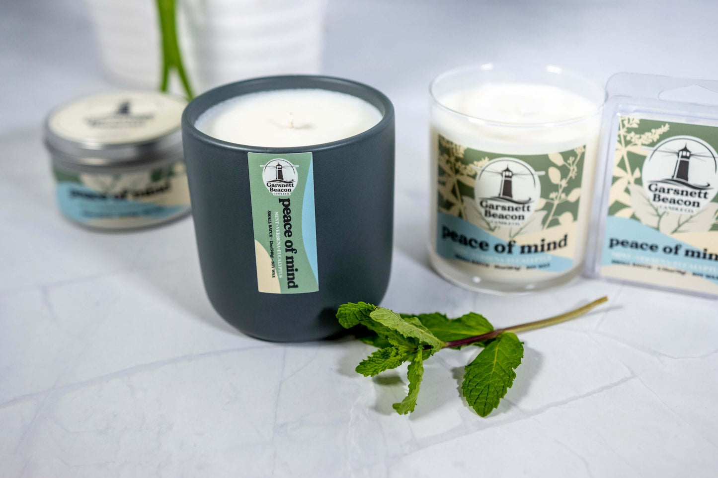Fresh Mint Verbena Greens Eucalyptus scented candles called Peace of Mind in glass ceramic tin and wax melts
