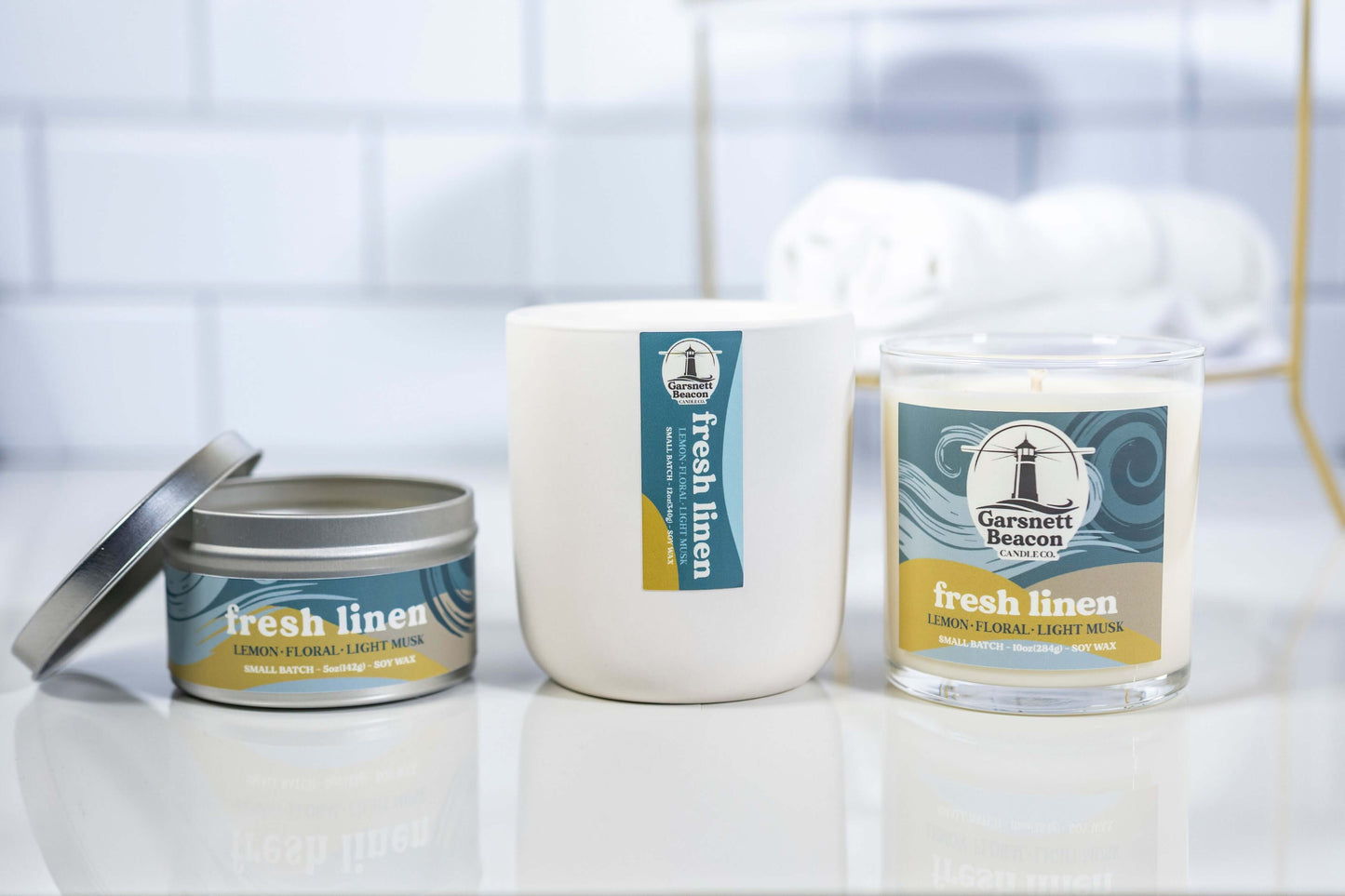 Lemon Linen Floral Ozone Light Musk scented candles called Fresh Linen in glass ceramic tin and wax melts