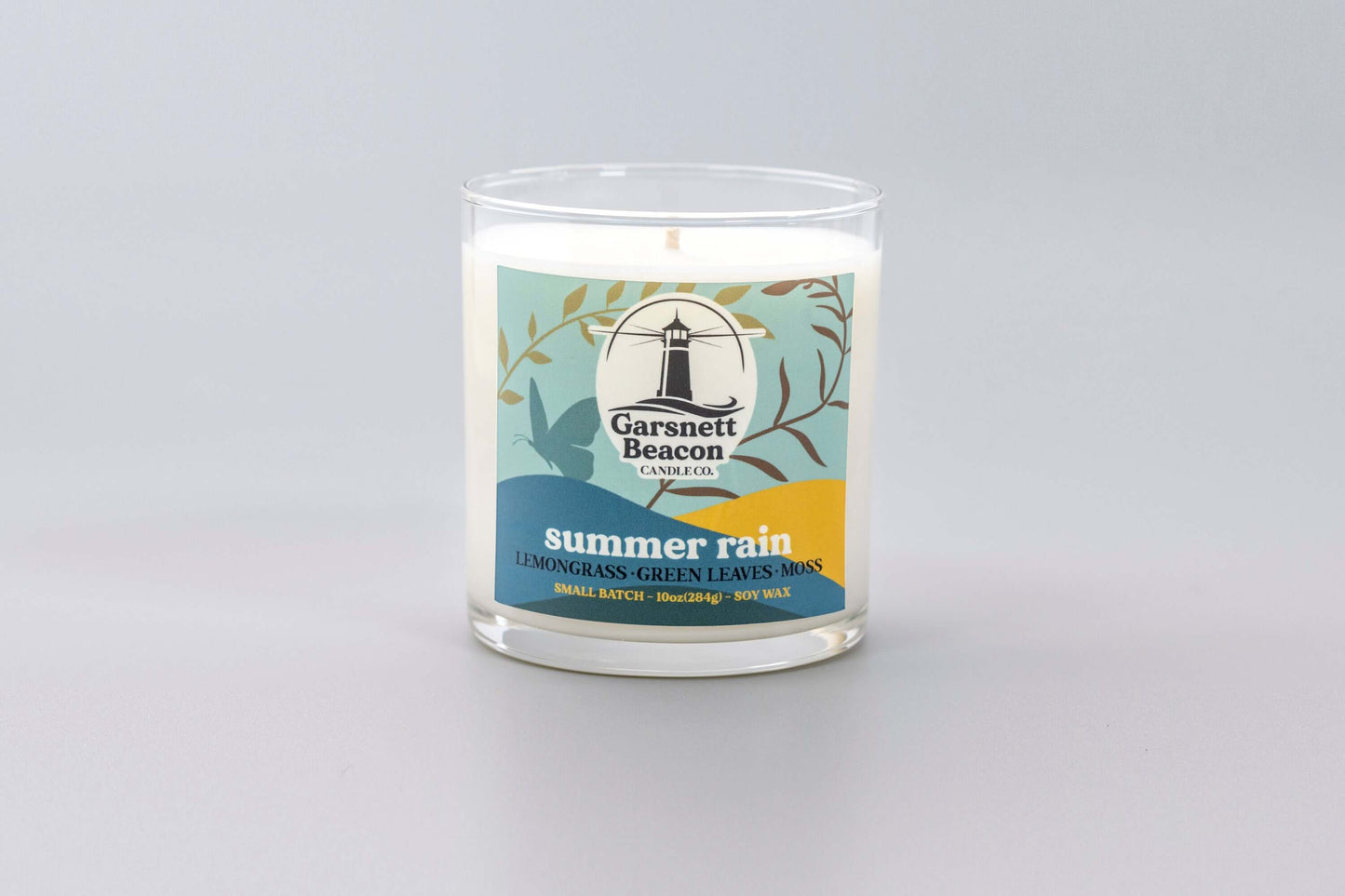 Lemongrass Green Leaves Lily of the Valley Ozone Moss scented candles called Summer Rain in glass ceramic tin and wax melts