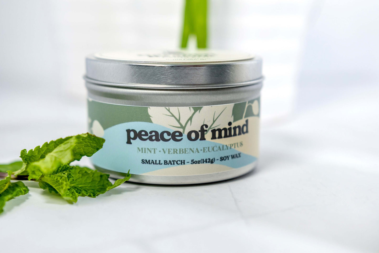 Fresh Mint Verbena Greens Eucalyptus scented candles called Peace of Mind in glass ceramic tin and wax melts