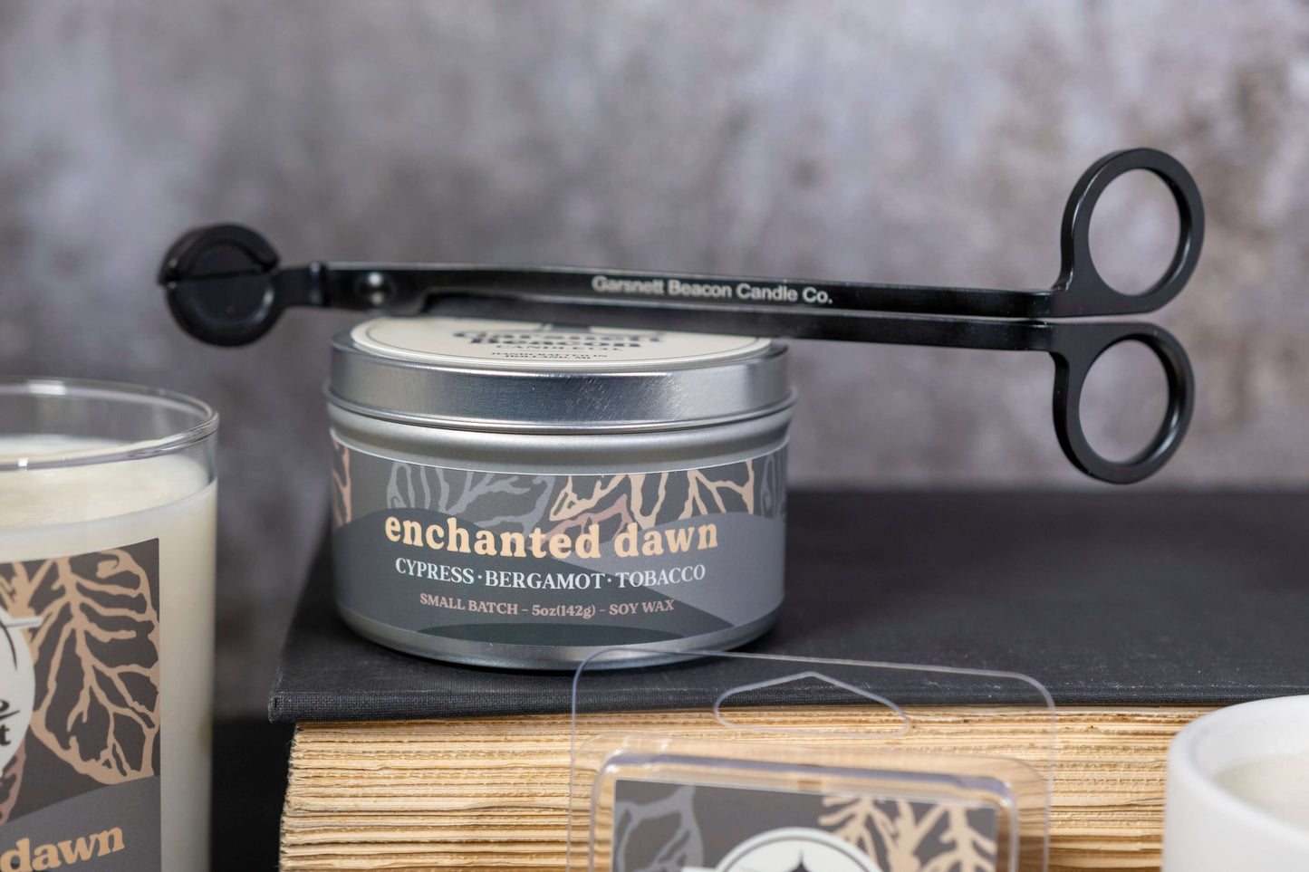 Cypress Bergamot Saffron Flower Patchoili scented candles called Enchanted Dawn in glass ceramic tin and wax melts