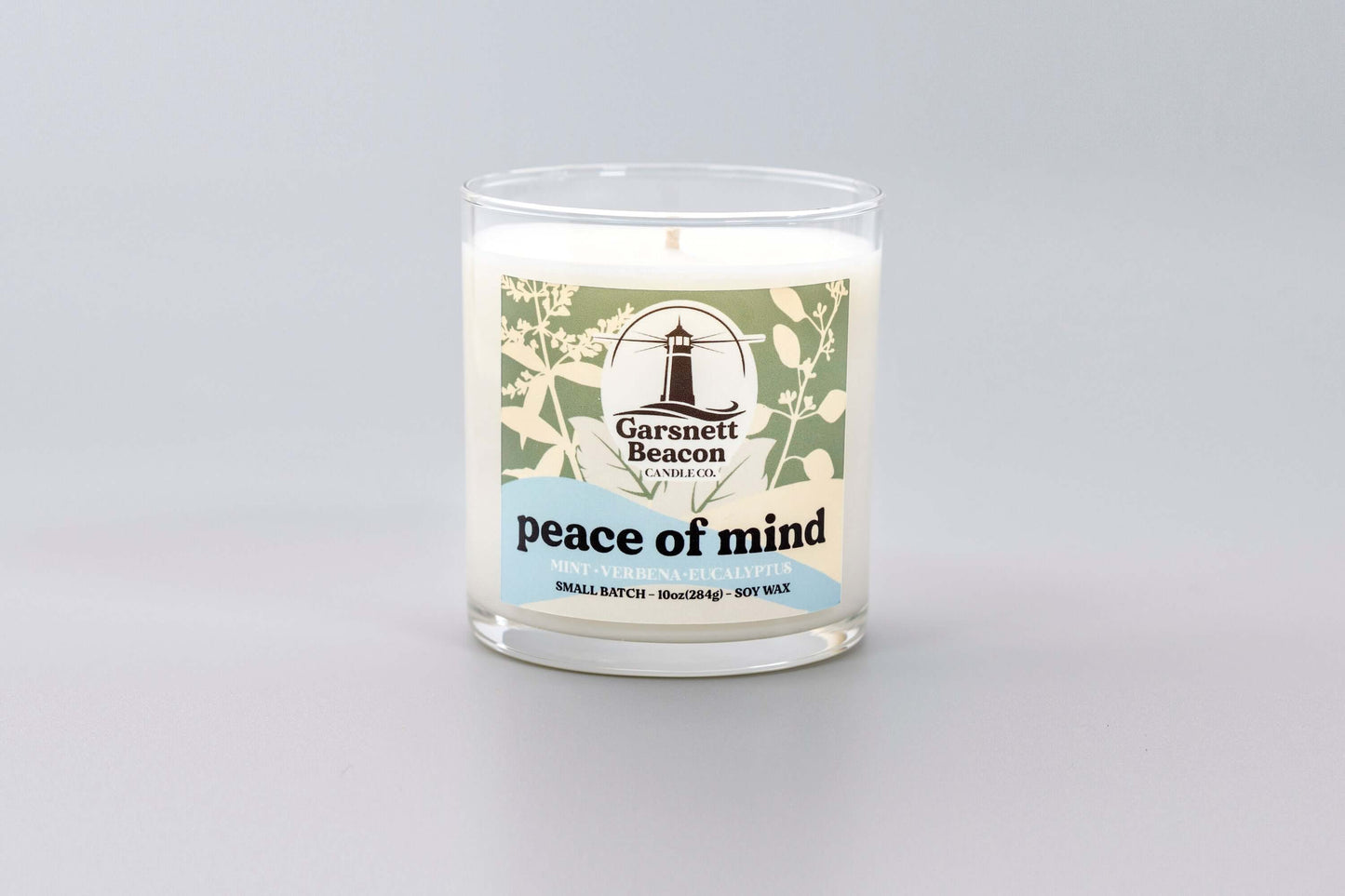 Fresh Mint Verbena Greens Eucalyptus scented candles called Peace of Mind in glass ceramic tin and wax melts