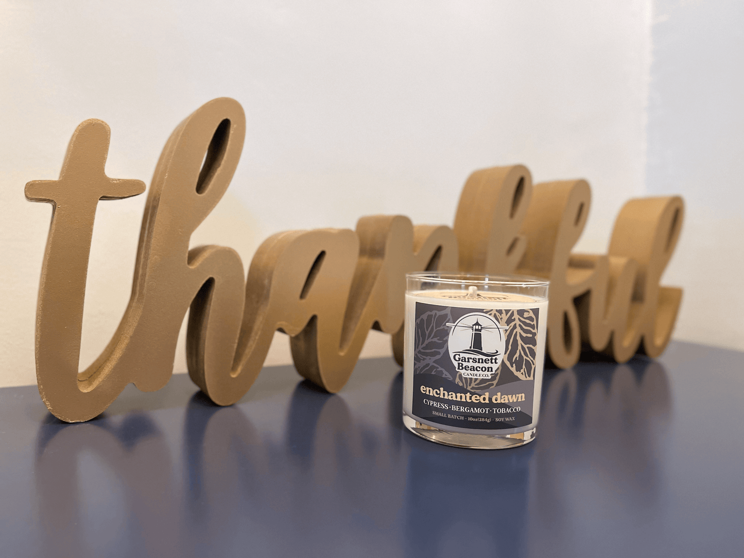 Cypress Bergamot Saffron Flower Patchoili scented candles called Enchanted Dawn in glass ceramic tin and wax melts