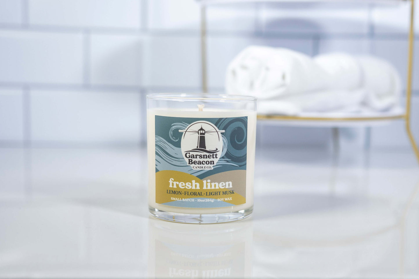 Lemon Linen Floral Ozone Light Musk scented candles called Fresh Linen in glass ceramic tin and wax melts