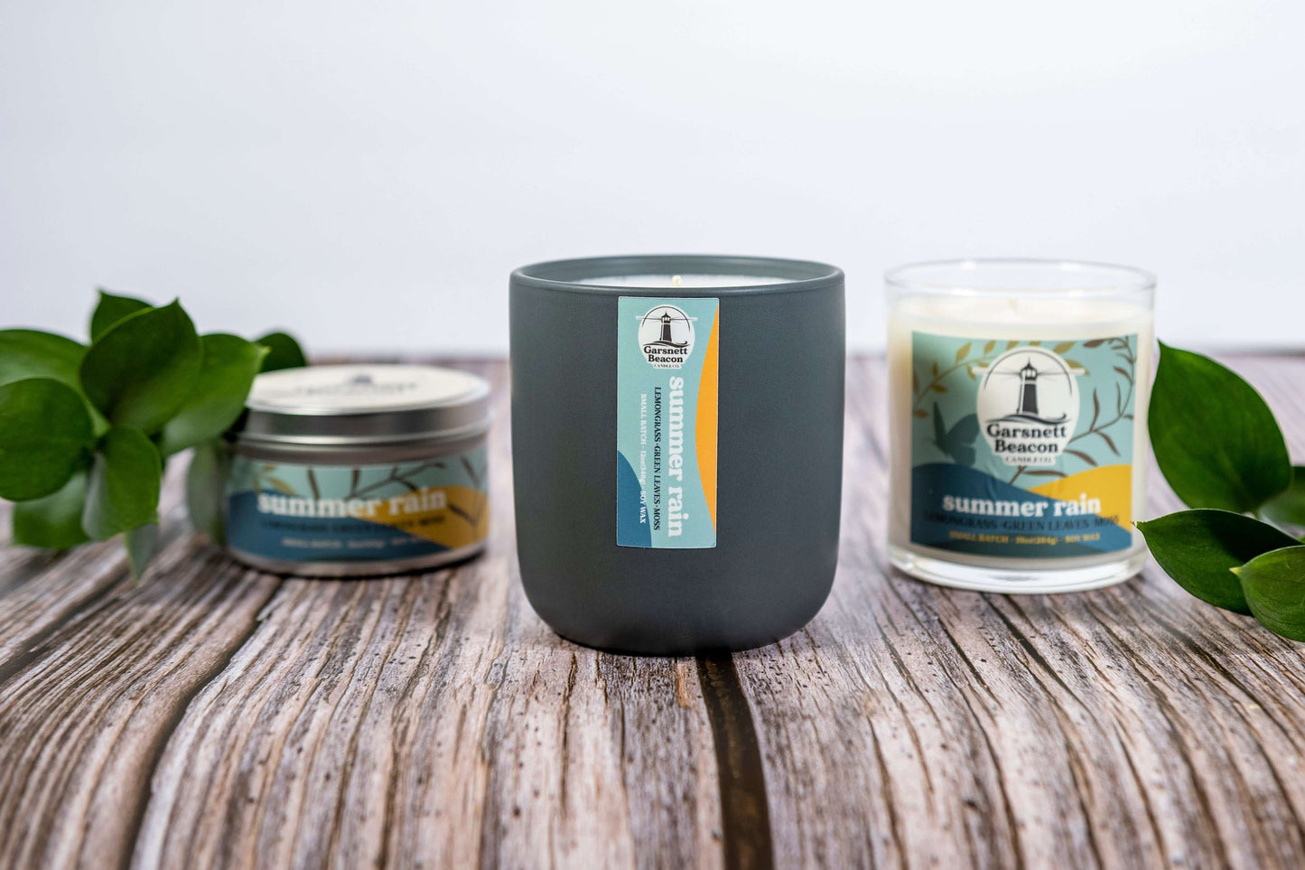 Lemongrass Green Leaves Lily of the Valley Ozone Moss scented candles called Summer Rain in glass ceramic tin and wax melts