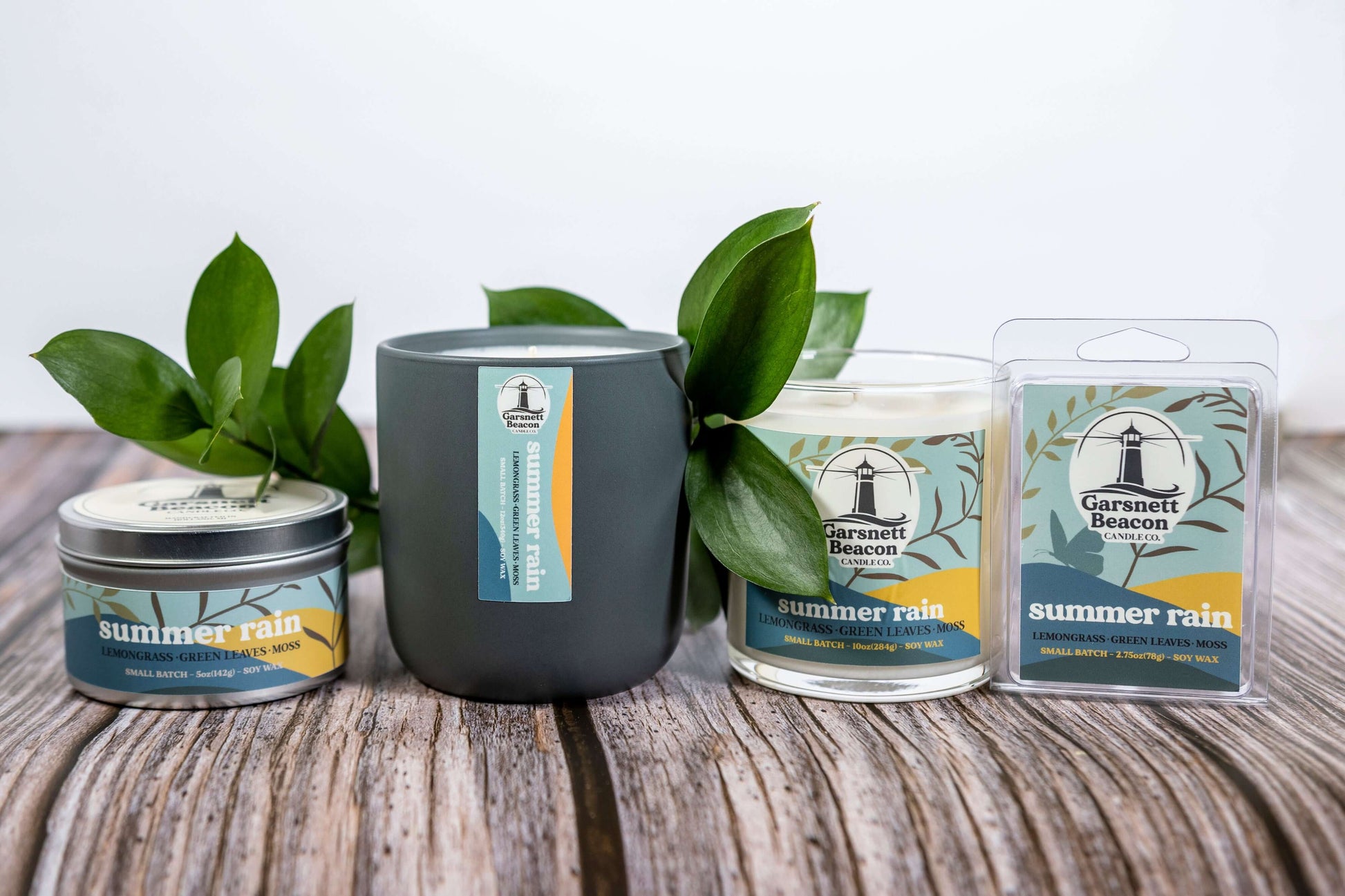 Lemongrass Green Leaves Lily of the Valley Ozone Moss scented candles called Summer Rain in glass ceramic tin and wax melts