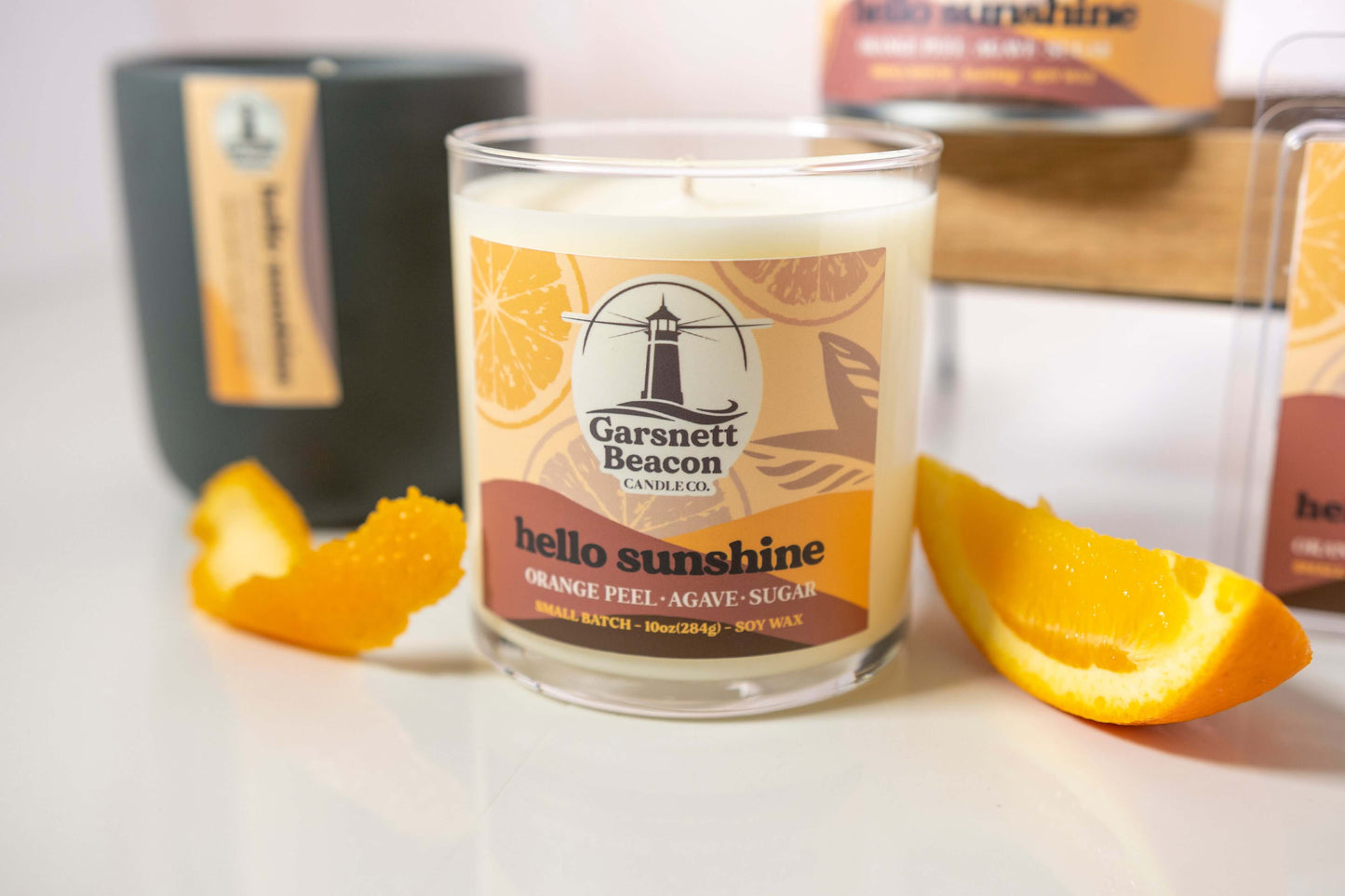 Orange Peel Lemon Peel Agave Tangerine Grapefruit Peach Lime Sugar scented candles called Hello Sunshine in glass ceramic tin and wax melts