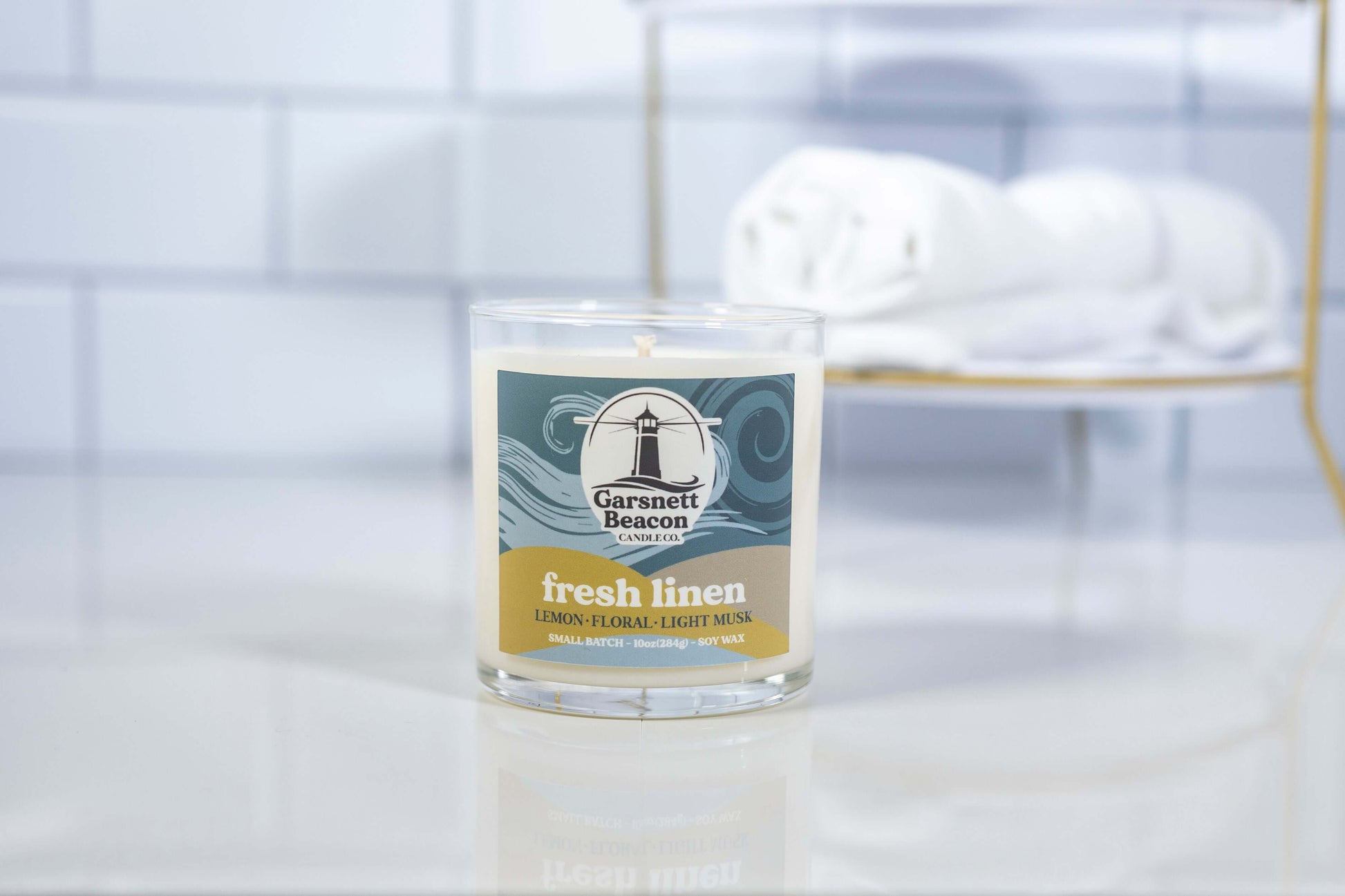 Lemon Linen Floral Ozone Light Musk scented candles called Fresh Linen in glass ceramic tin and wax melts