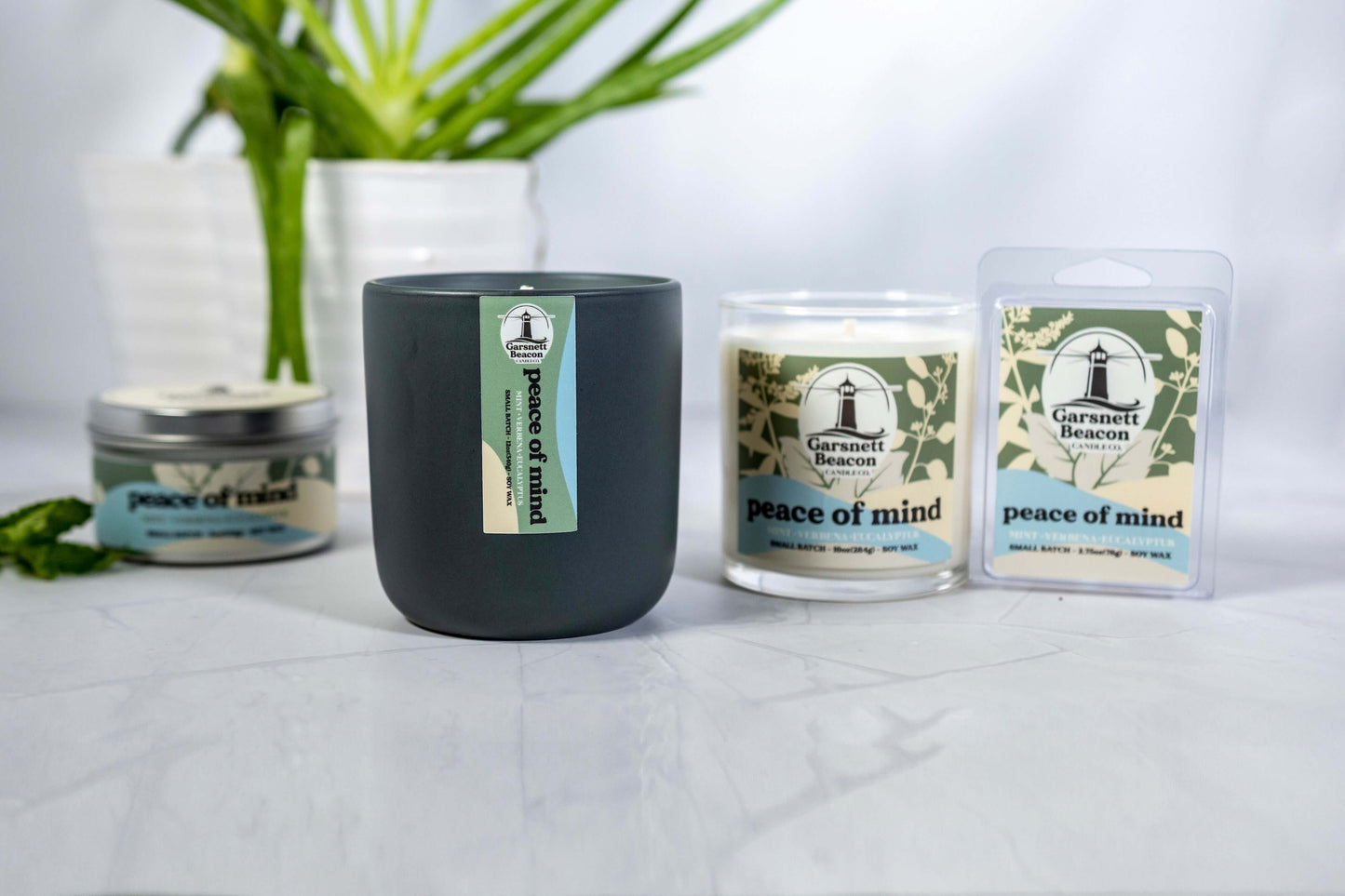 Fresh Mint Verbena Greens Eucalyptus scented candles called Peace of Mind in glass ceramic tin and wax melts